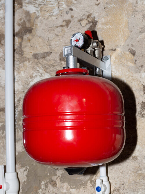 an expansion tank for the water heating system to regulate the volume of the coolant. Heating of a private residential building.