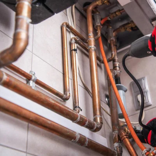 plumber identifying a gas leak